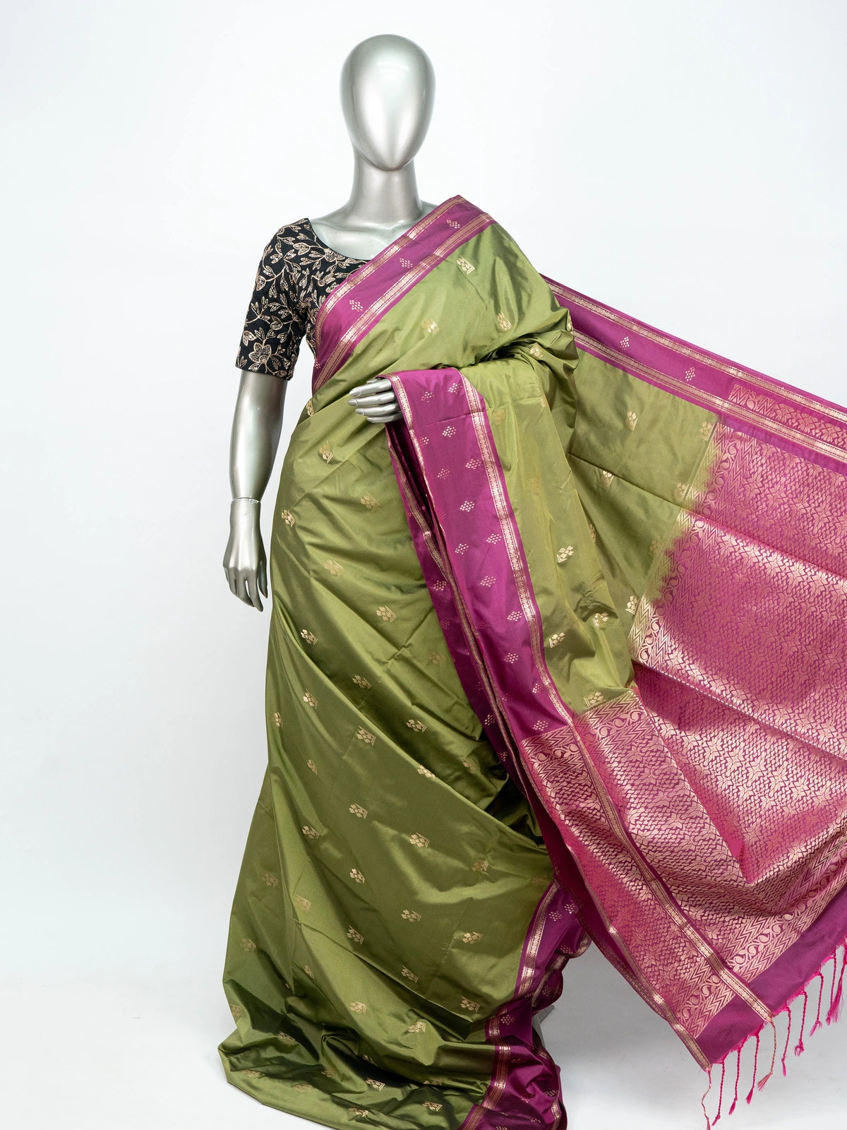 Mehndi green semi silk saree with magenta contrast border, gold zari buttas and woven pallu