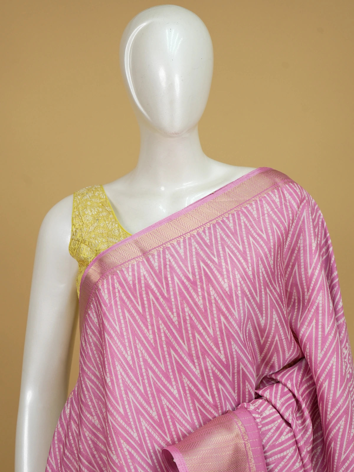 Pink and white chevron printed designer saree with gold zari border and tree-of-life pallu