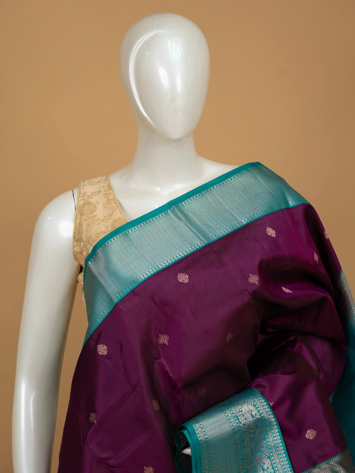 Purple pure Kanchipuram silk saree with teal contrast border and silver zari buti motifs