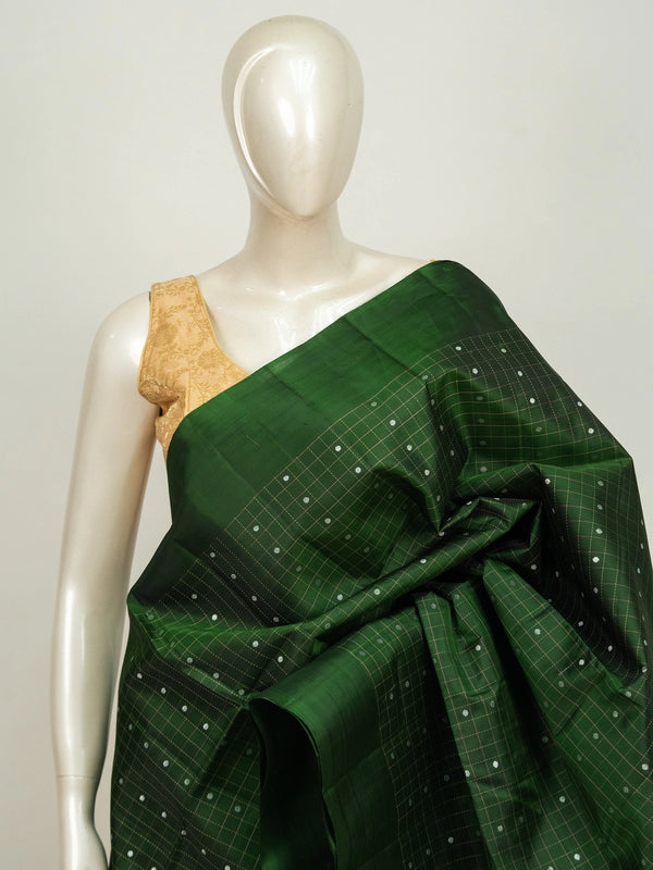 Dark green Kanchipuram pure mix saree with checked body and contrast beige-gold zari pallu and border
