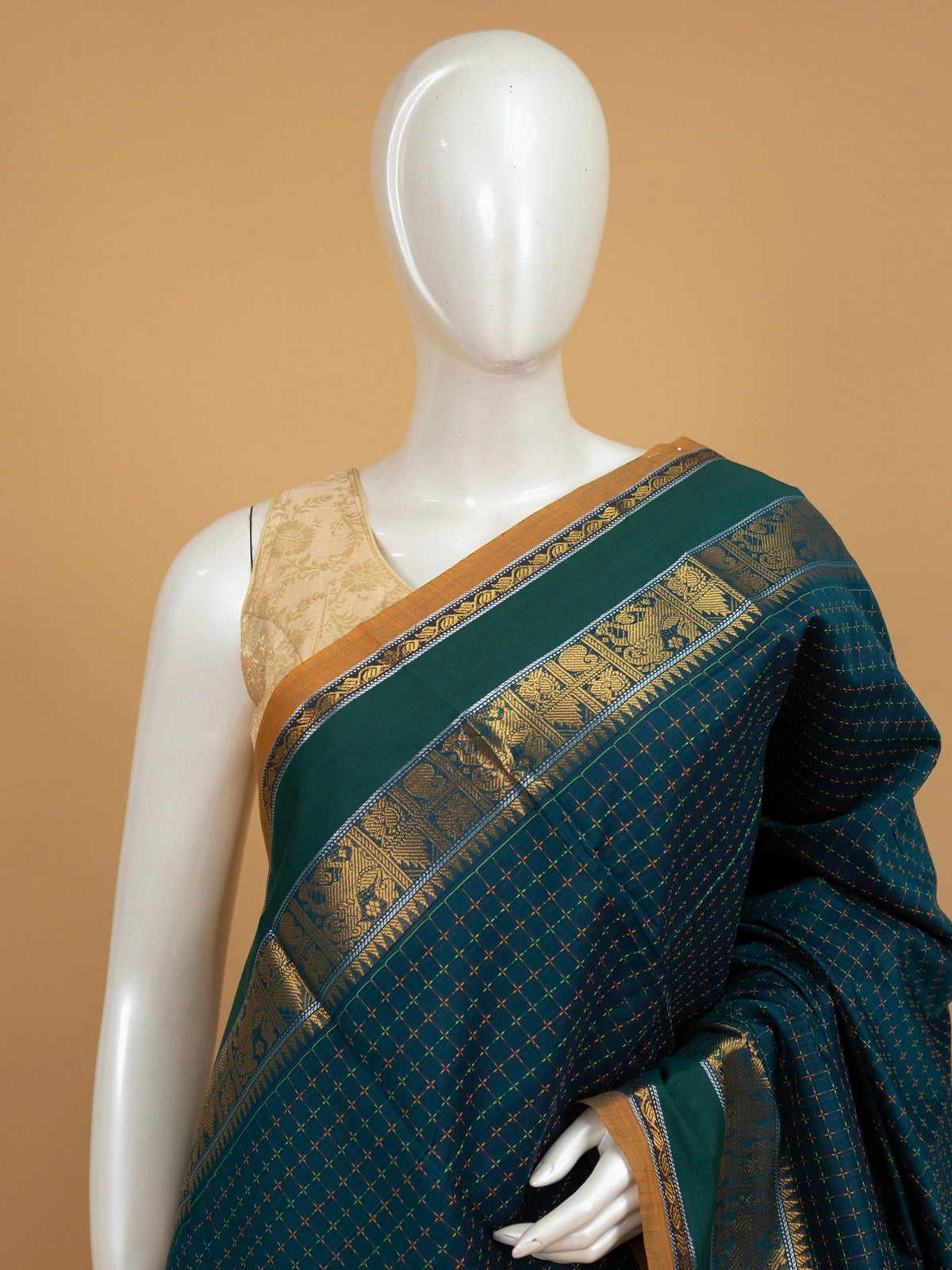 Peacock green Chettinad cotton saree with checked body, gold zari border and maroon striped pallu