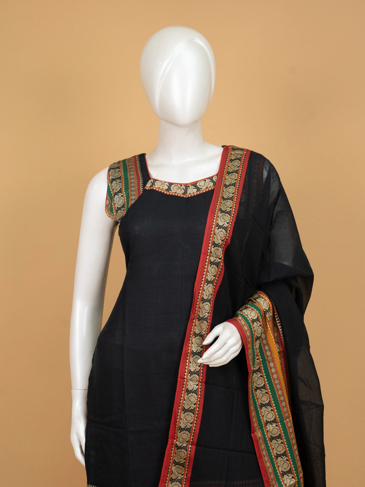 Black cotton straight cut kurti set with peacock woven borders, red pants and multicolour dupatta
