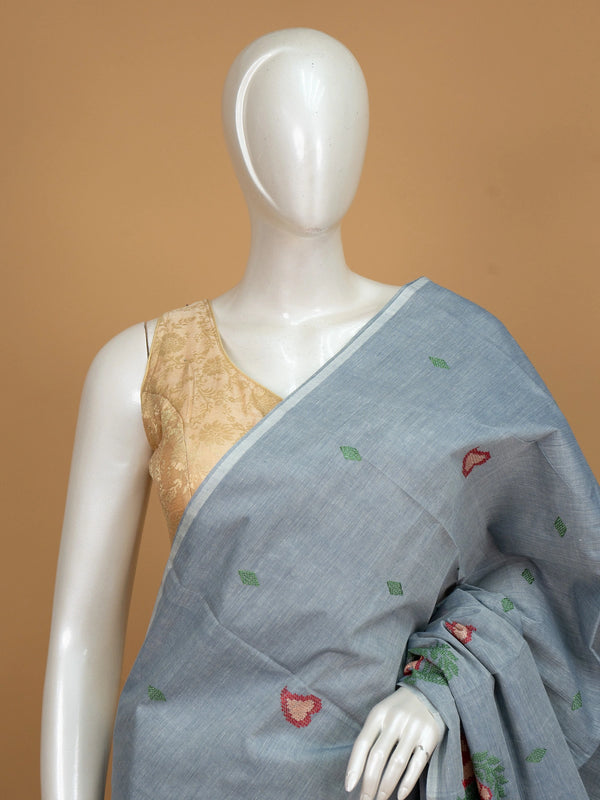 Grey linen cotton saree with red and cream floral buta motifs and striped pallu