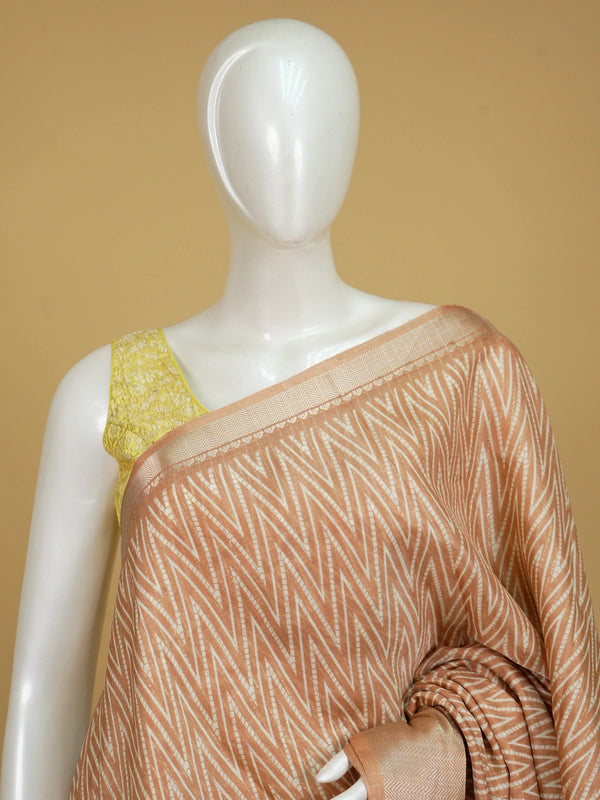 Peach and white designer saree with chevron print, gold zari border and tree-of-life pallu