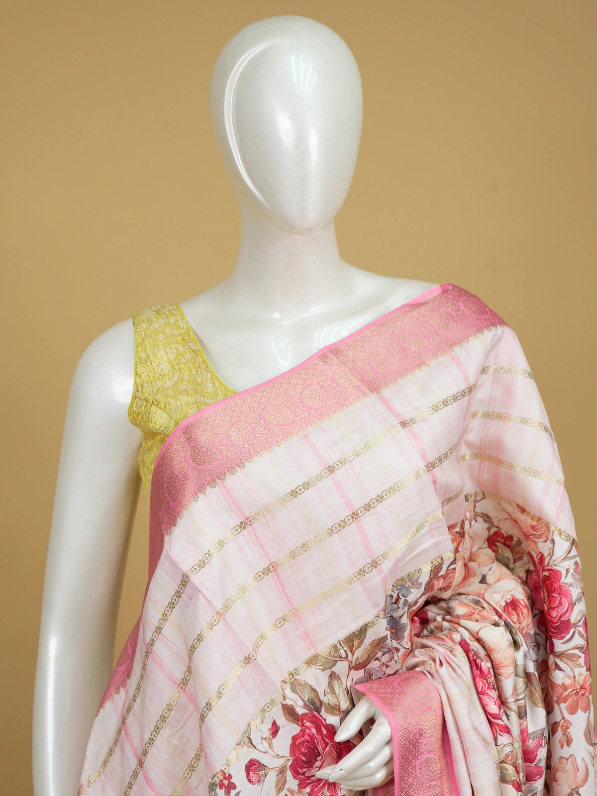 Off-white and pink floral semi tussar saree with gold zari stripes and contrast pink zari border