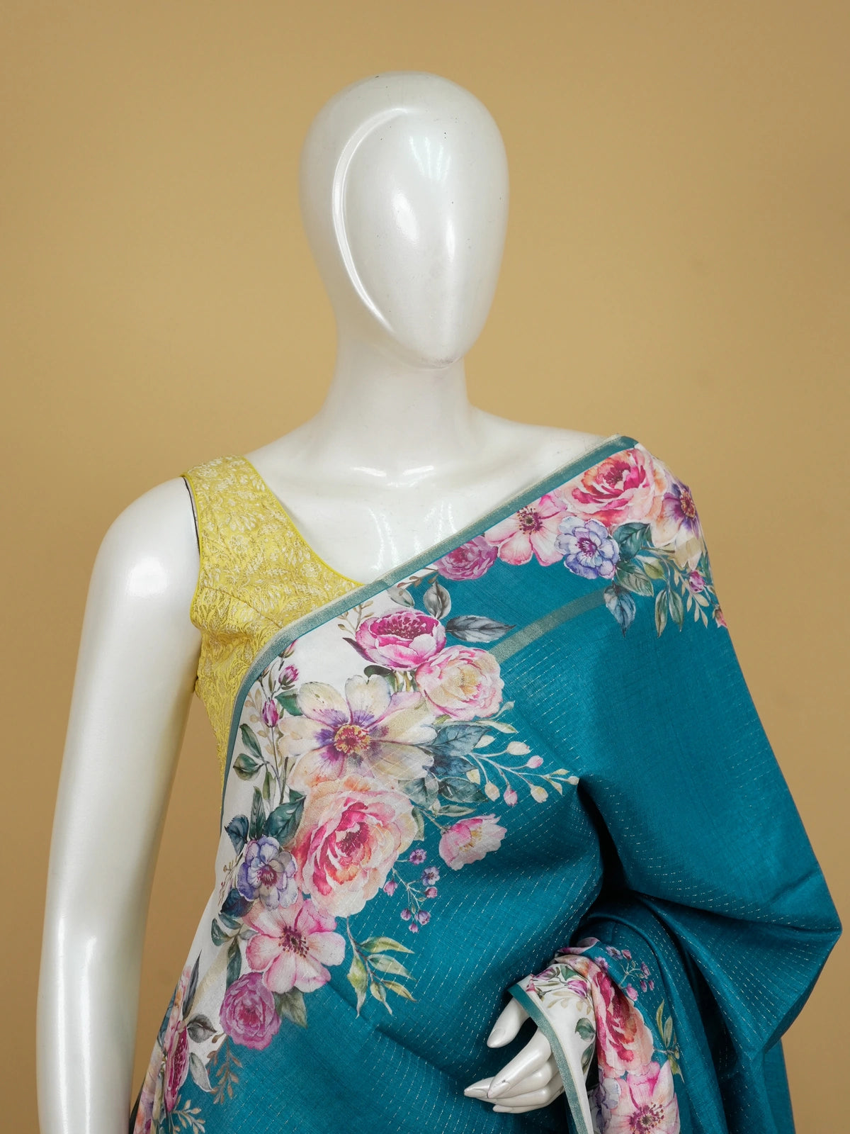 Teal blue semi tussar saree with ivory floral border and silver zari striping
