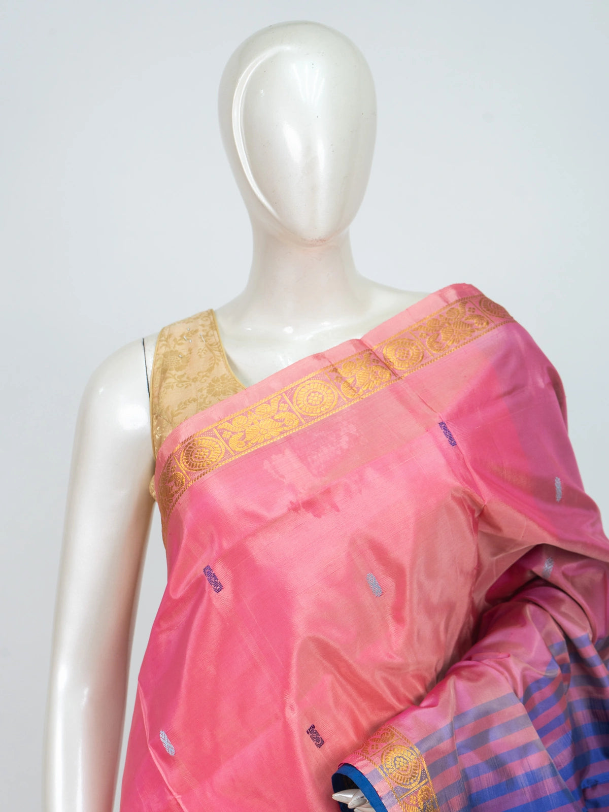 Pink Banana silk saree with contrast blue pallu, gold zari border and woven buttis