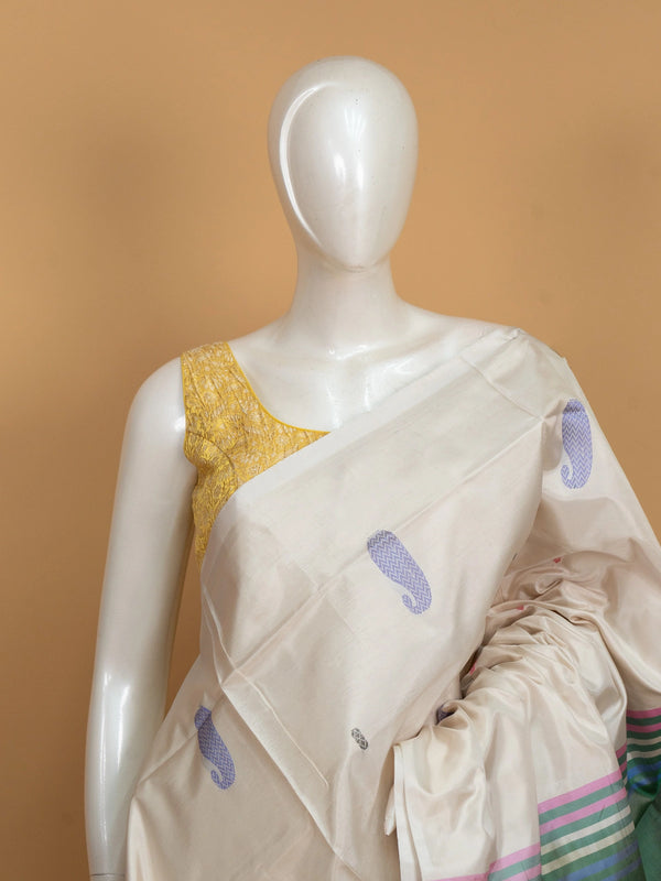 Cream banana silk saree with multicolour paisley buttas and contrast green striped pallu and border