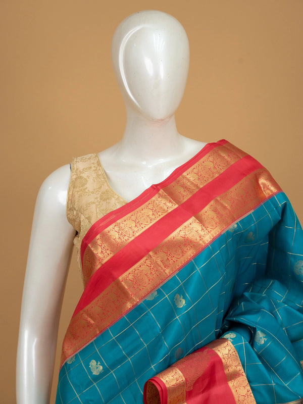 Peacock blue pure Kanchipuram silk saree with gold zari checks, peacock motifs and contrast pink zari border