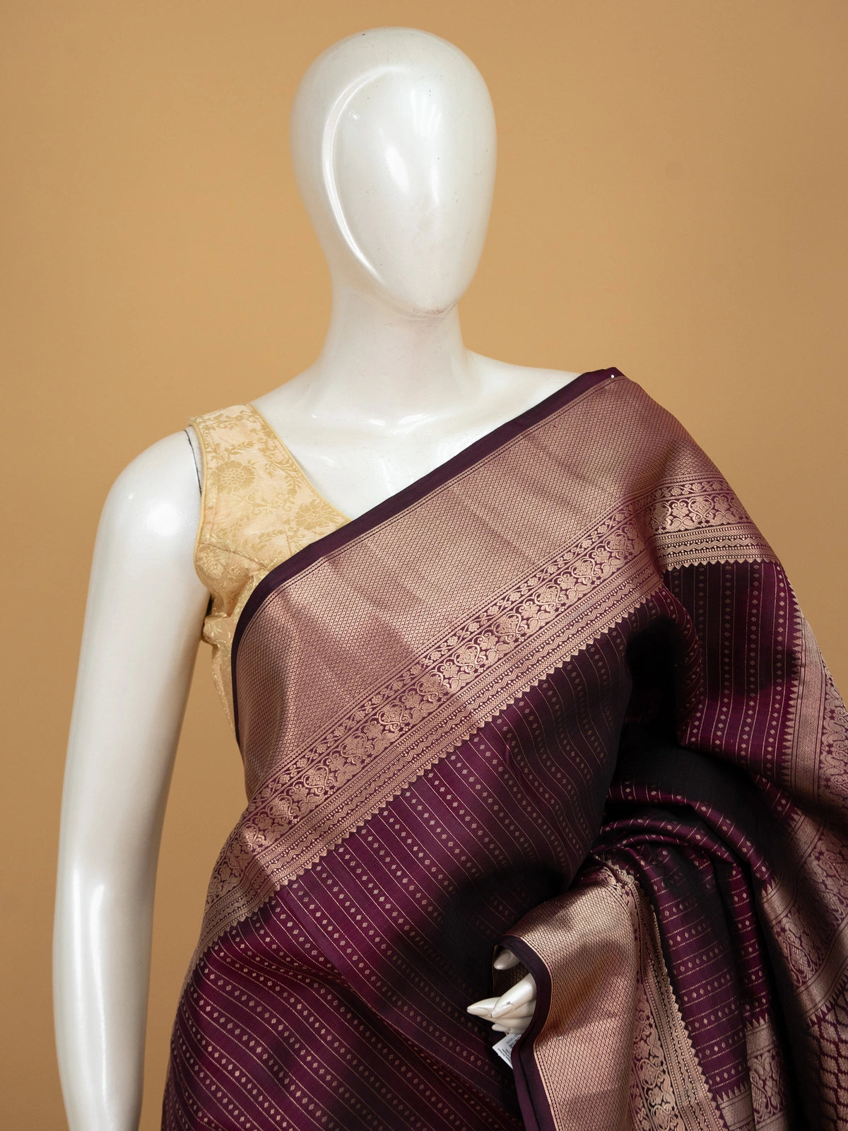 Wine purple pure Kanchipuram silk saree with gold zari striped body, contrast border and diamond jaali pallu
