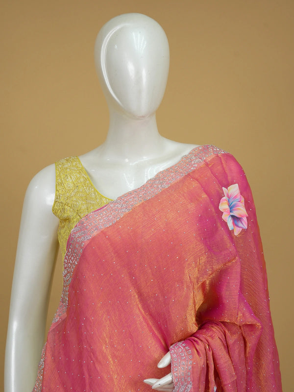 Pink and gold designer tissue saree with scattered stone work, multicolour floral prints and a stone-studded scalloped border.