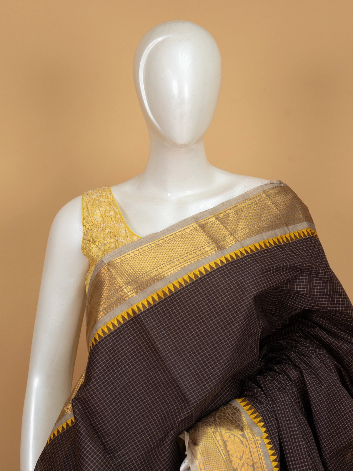 Dark brown Chettinad cotton saree with fine checks and contrast gold zari temple border