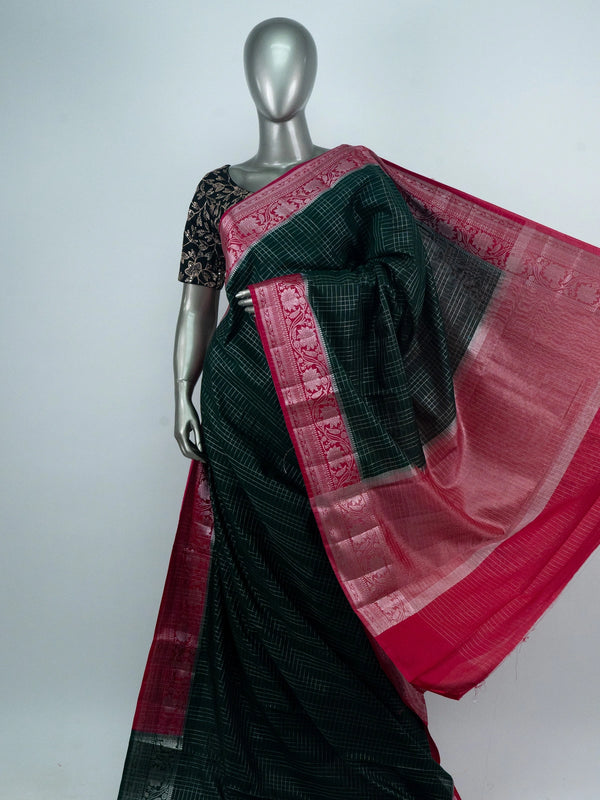 Bottle green semi raw silk saree with silver zari checks and contrast pink floral zari border
