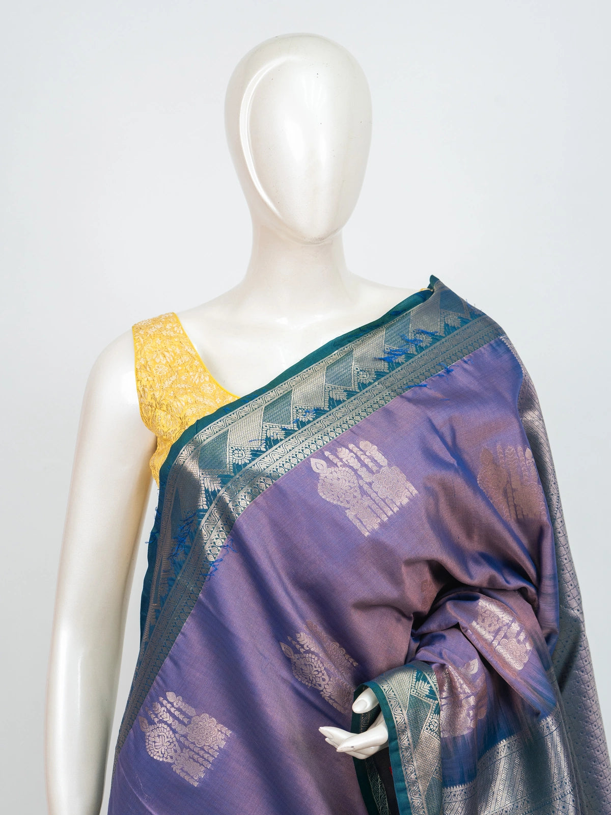 Lavender semi silk saree with teal blue contrast border and silver zari buttas
