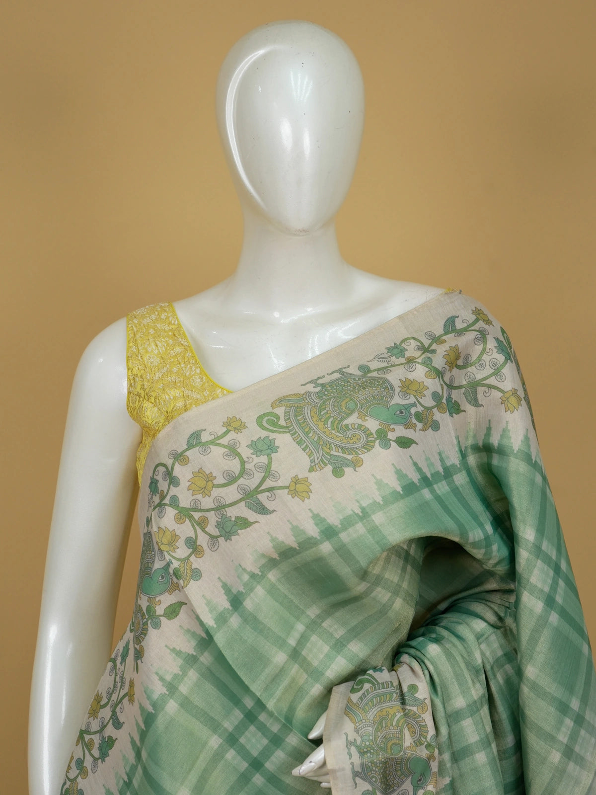 Sea green and cream linen cotton saree with checked body and Kalamkari peacock floral pallu