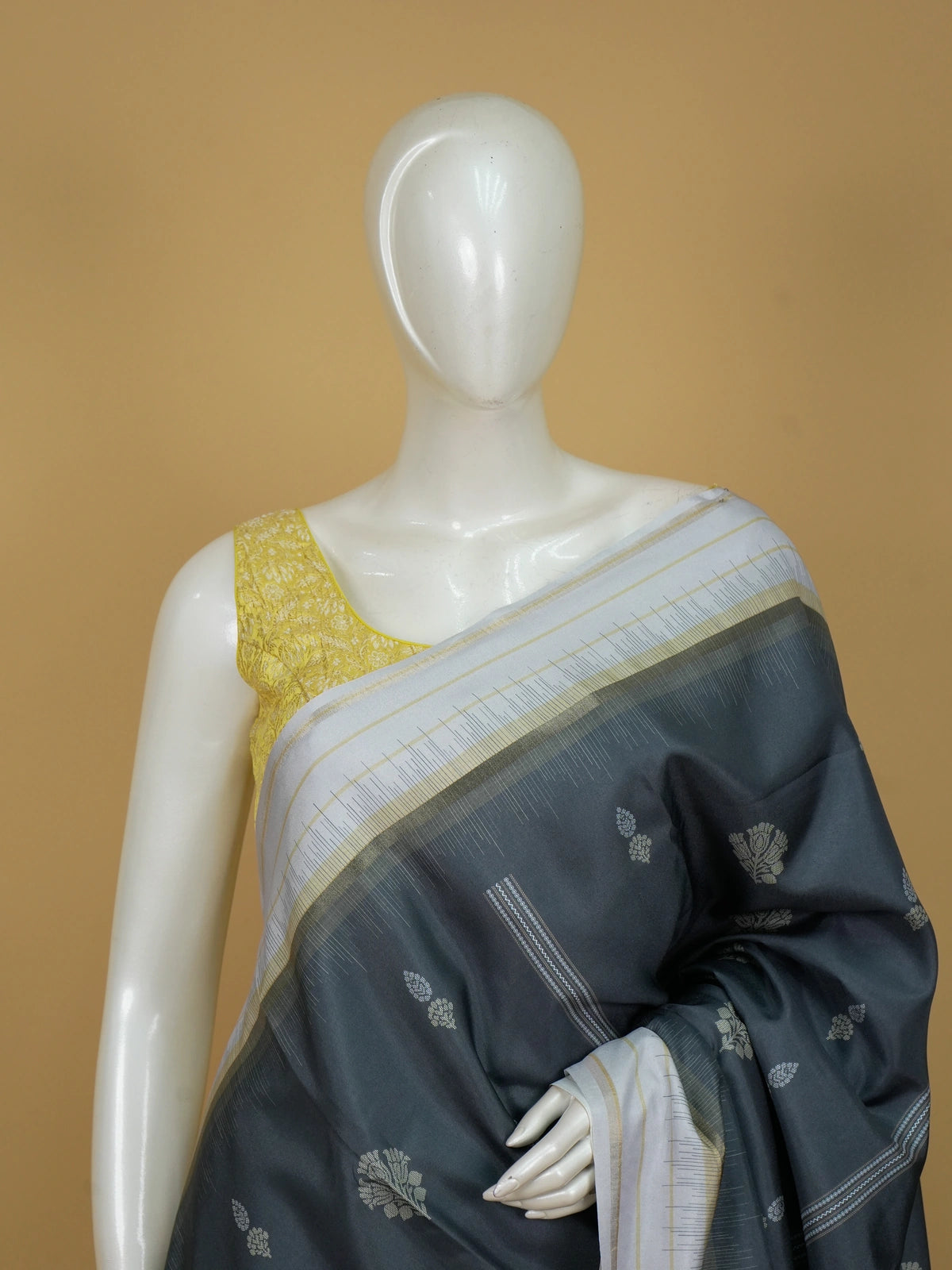 Grey Dola silk saree with cream gold zari border and floral buttis