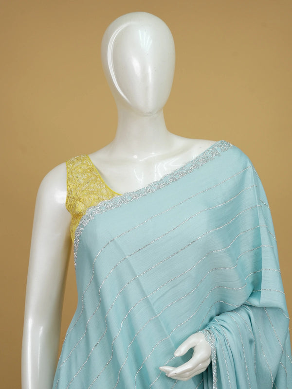 Sky blue designer georgette saree with silver sequin stripes and contrast yellow embroidered blouse