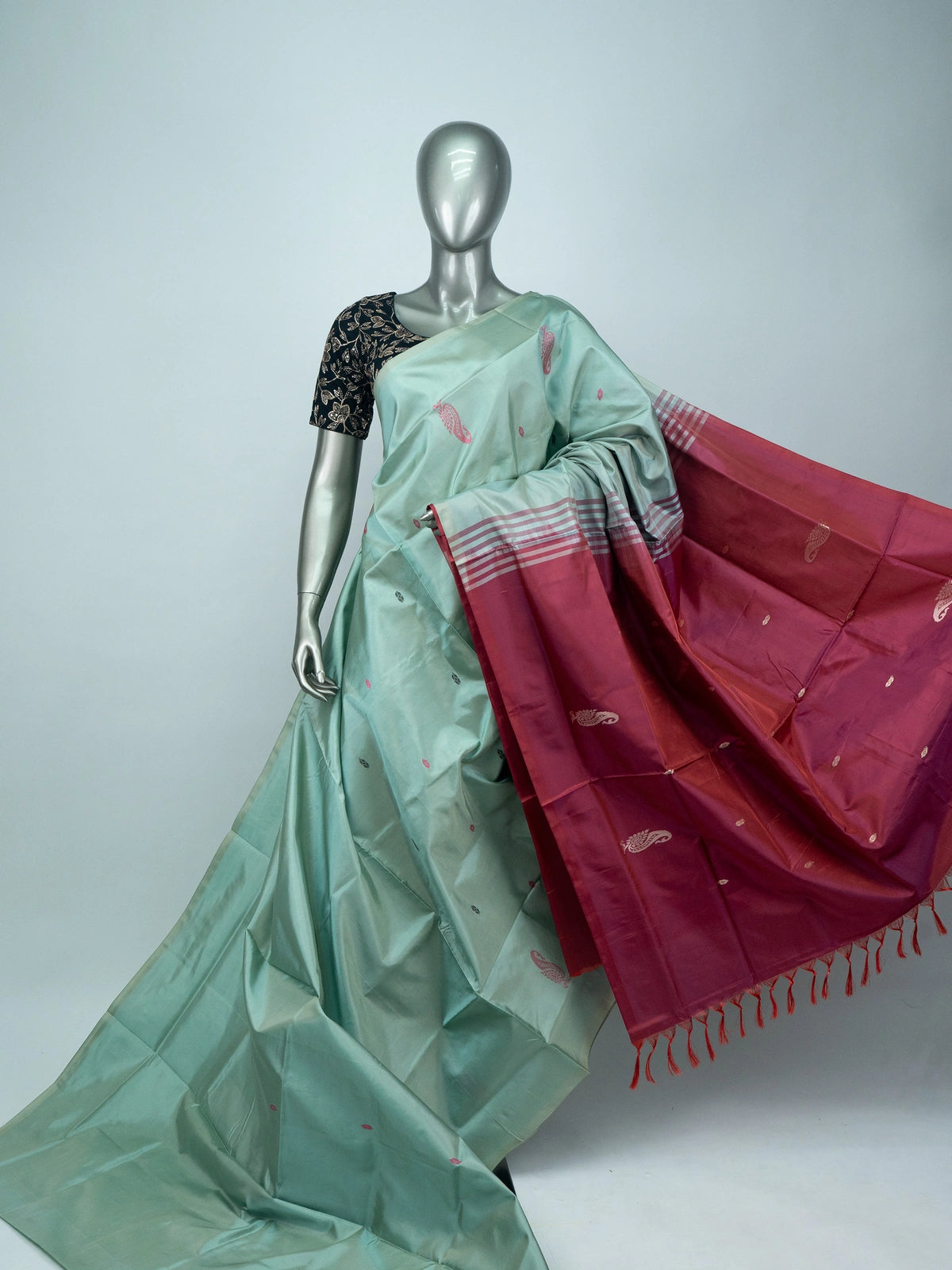 Sea green Banana Silk saree with contrast maroon pallu, paisley butta and silver zari motifs