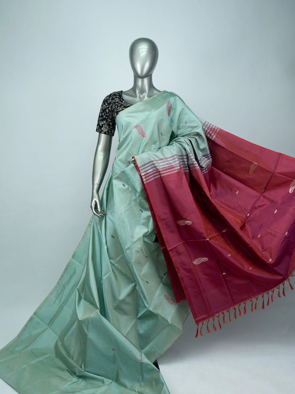 Sea green Banana Silk saree with contrast maroon pallu, paisley butta and silver zari motifs