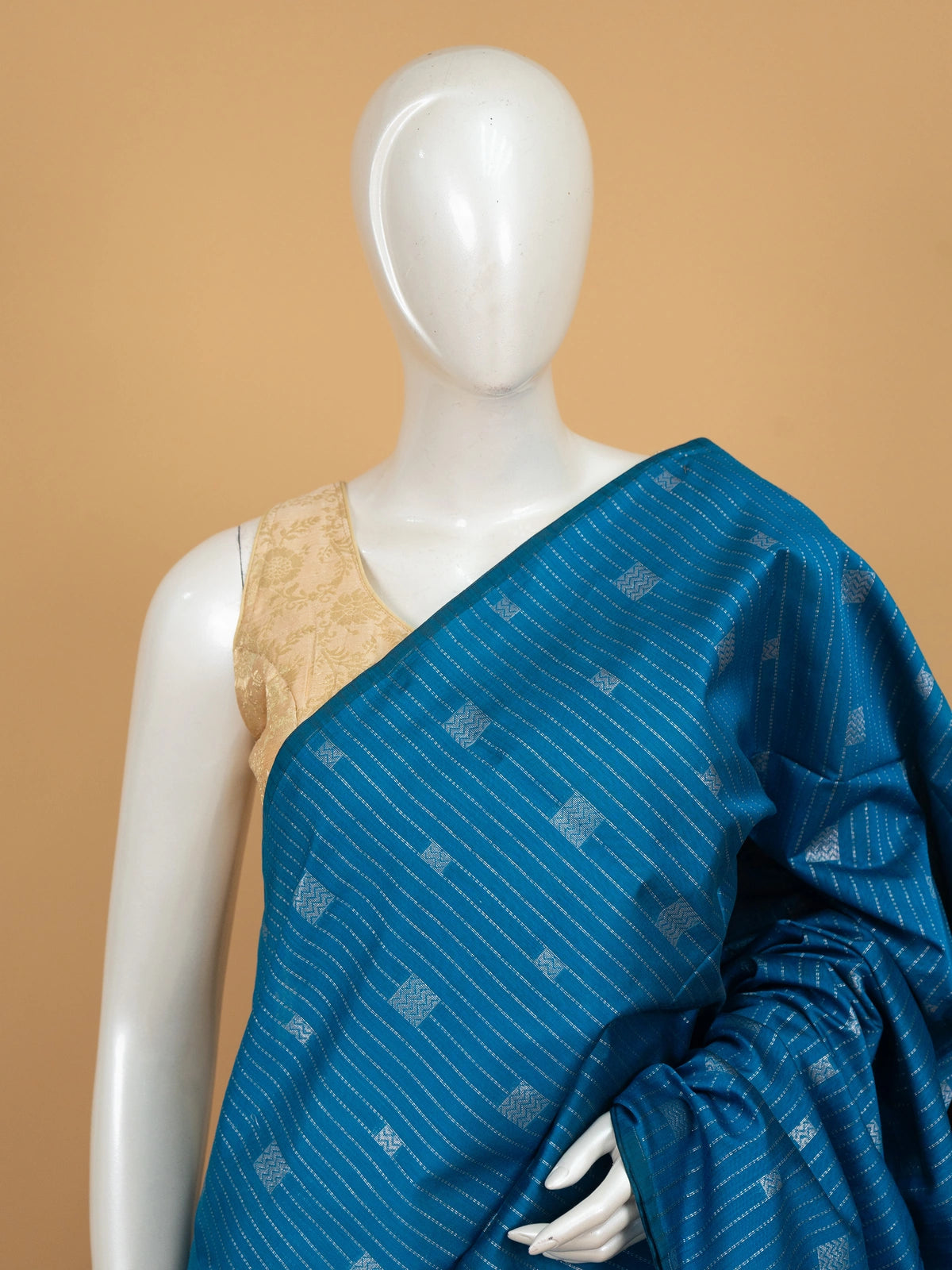 Peacock blue silk cotton saree with silver stripes, square buttas and contrast maroon zari border and pallu