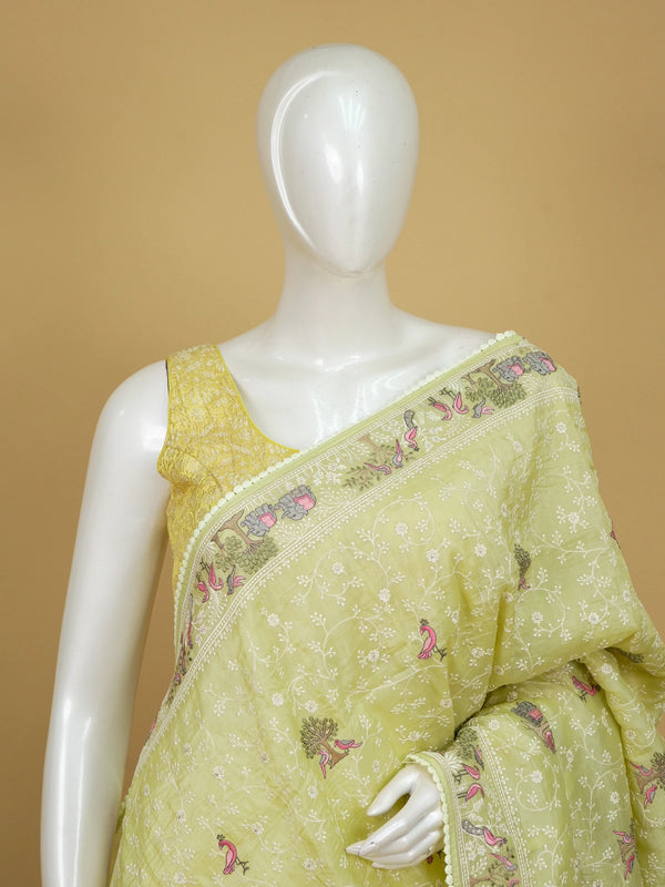 Lime green designer saree with white floral jaal, pink bird, tree and elephant embroidery and matching blouse