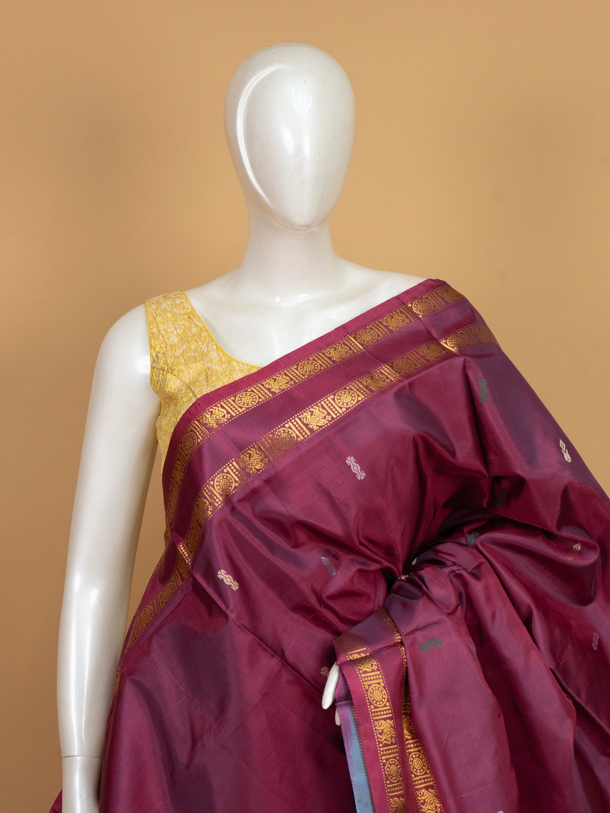 Maroon banana silk saree with gold zari border and contrast grey-blue pallu
