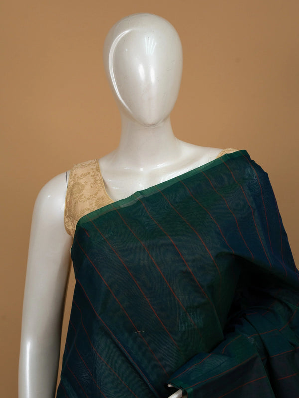Teal green silk cotton saree with maroon stripes and contrast striped pallu on mannequin