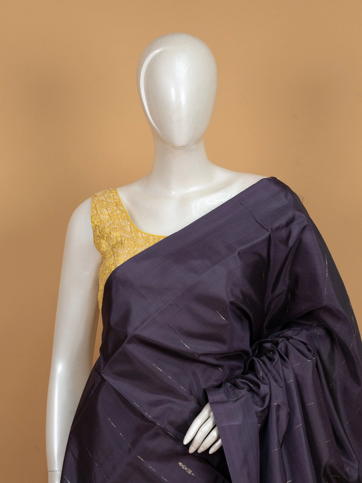 Aubergine banana silk saree with coral zari-striped pallu and contrast blouse