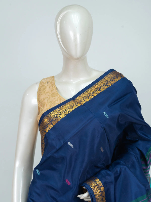 Navy blue Banana Silk saree with gold zari border, multicoloured buttis and contrast turquoise striped pallu