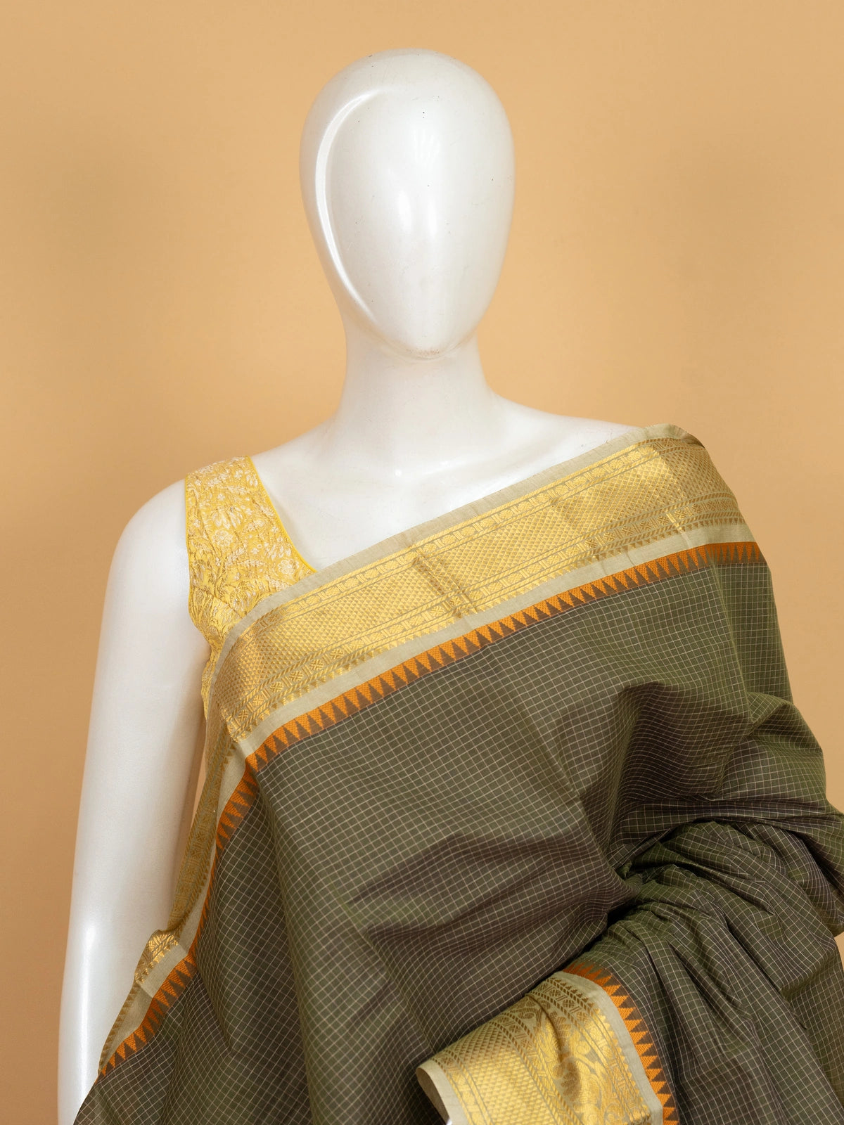 Olive green Chettinad cotton saree with checked body and gold zari border