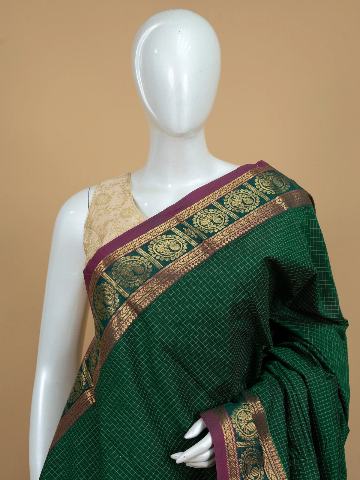 Green Chettinad cotton saree with yellow checks and a magenta gold zari peacock border