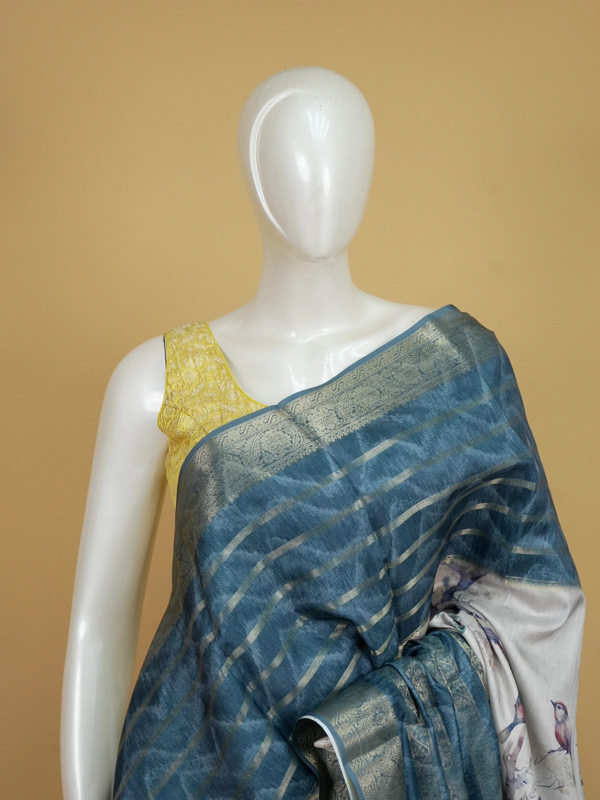 Teal blue and cream semi tussar saree with watercolour bird print and gold zari border