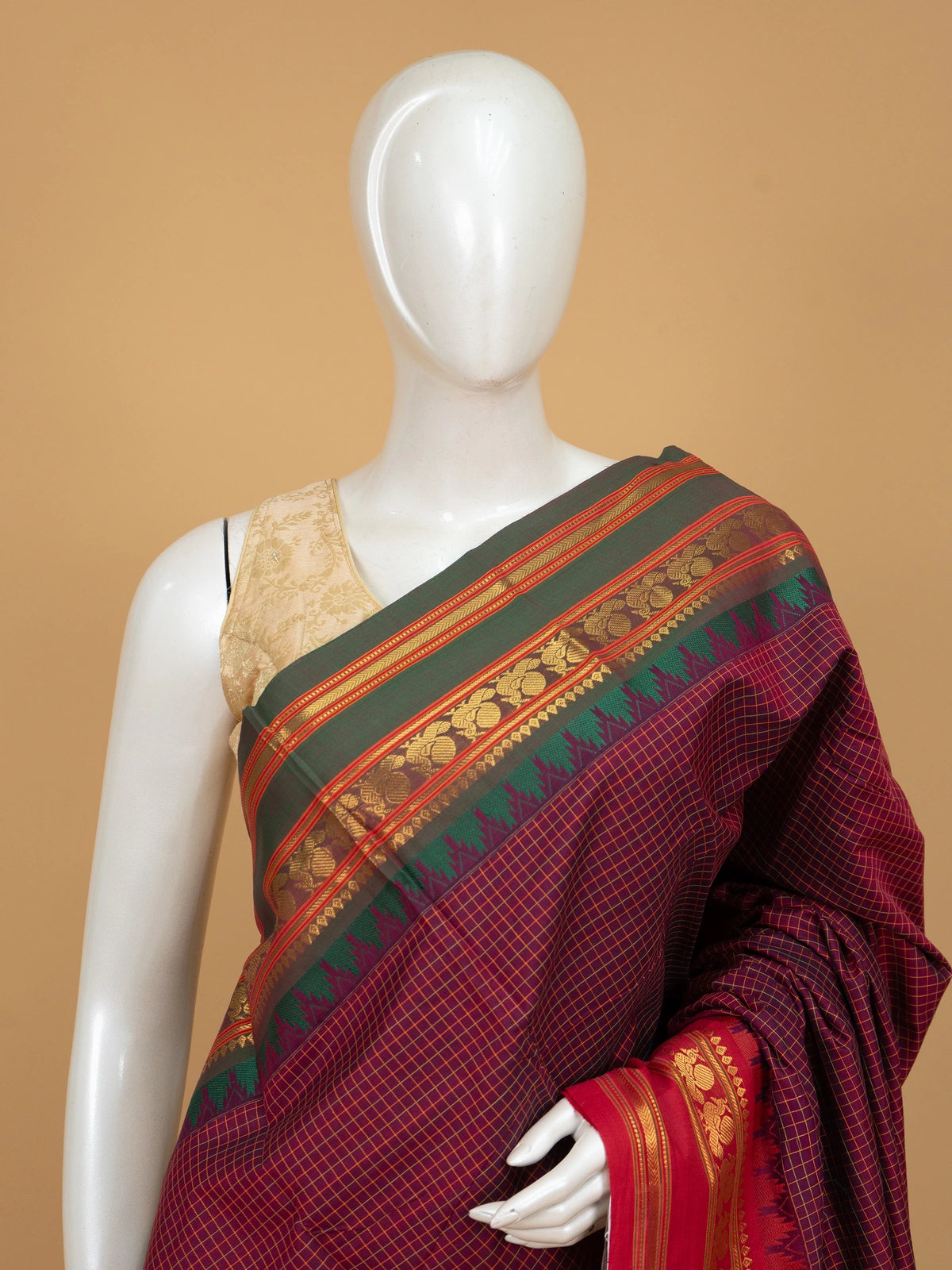 Maroon and blue Chettinad cotton saree with gold check body, contrast green zari border and striped blue pallu