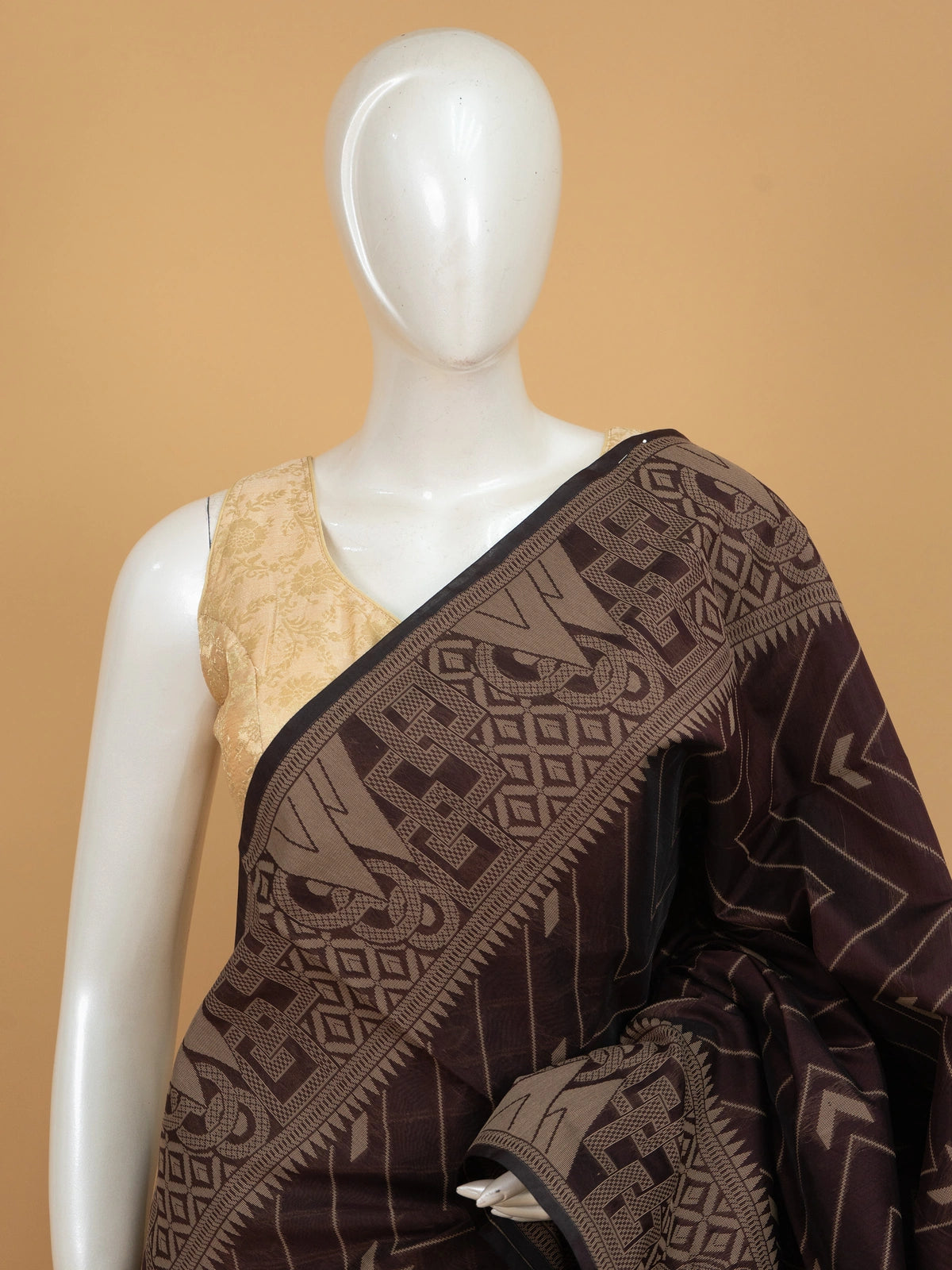 Dark brown silk cotton saree with chevron woven body and contrast peacock blue geometric pallu