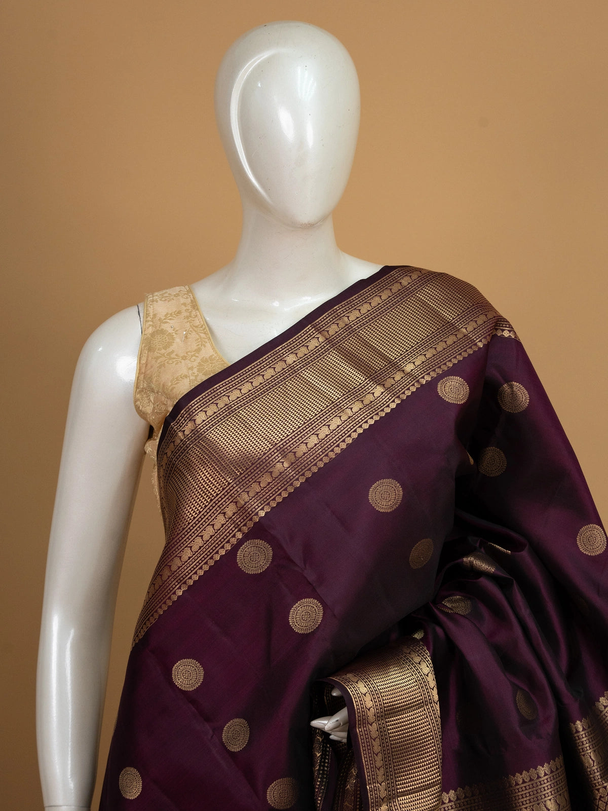 Deep purple pure Kanchipuram silk saree with gold zari circular buttas and contrast gold zari border