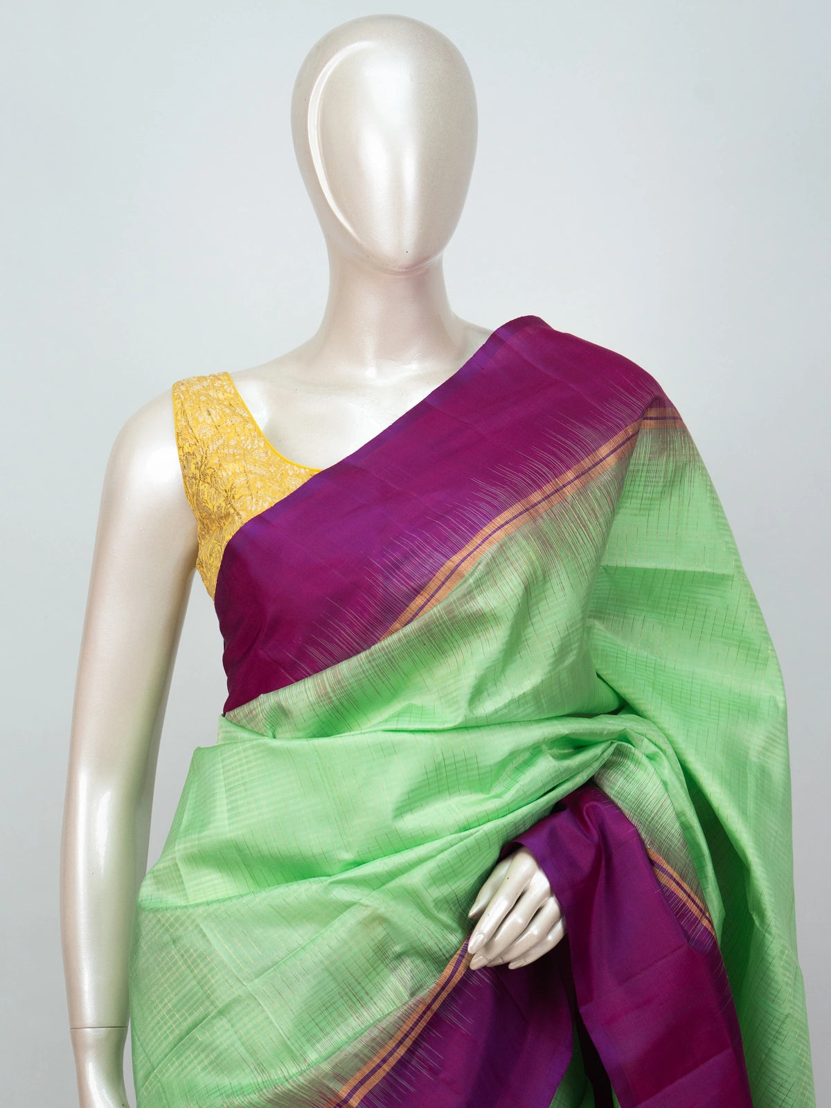 Parrot green soft silk saree with contrast magenta zari border and pallu