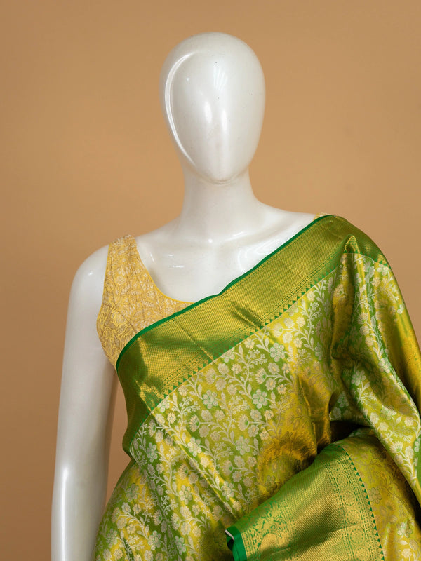 Parrot green and gold pure Kanchipuram silk saree with floral zari jaal and contrast green border