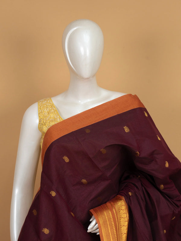 Maroon Chettinad cotton saree with contrast orange gold zari peacock border and zari buttas