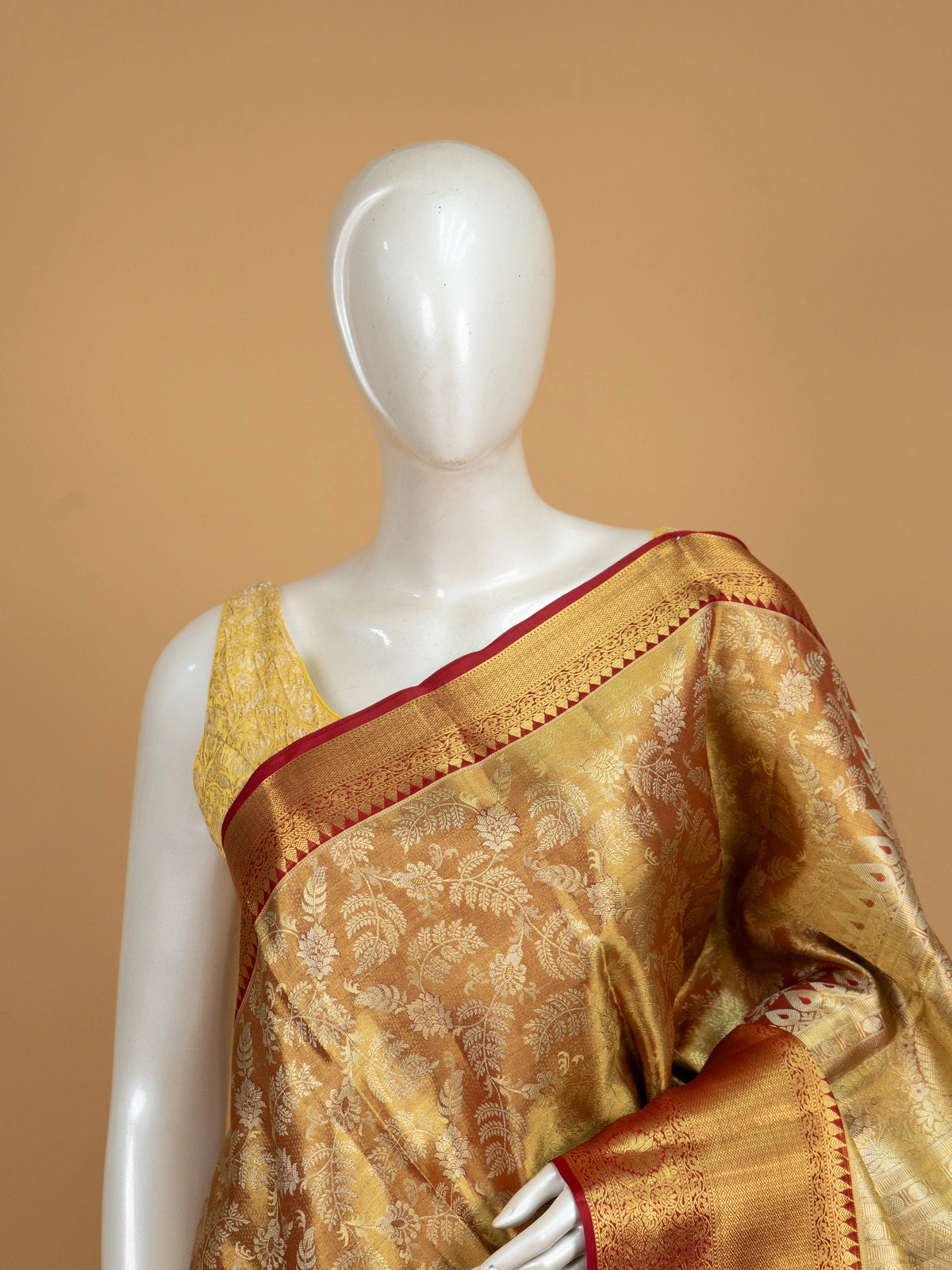 Mustard-gold pure Kanchipuram silk saree with gold zari floral jaal and contrast red zari border