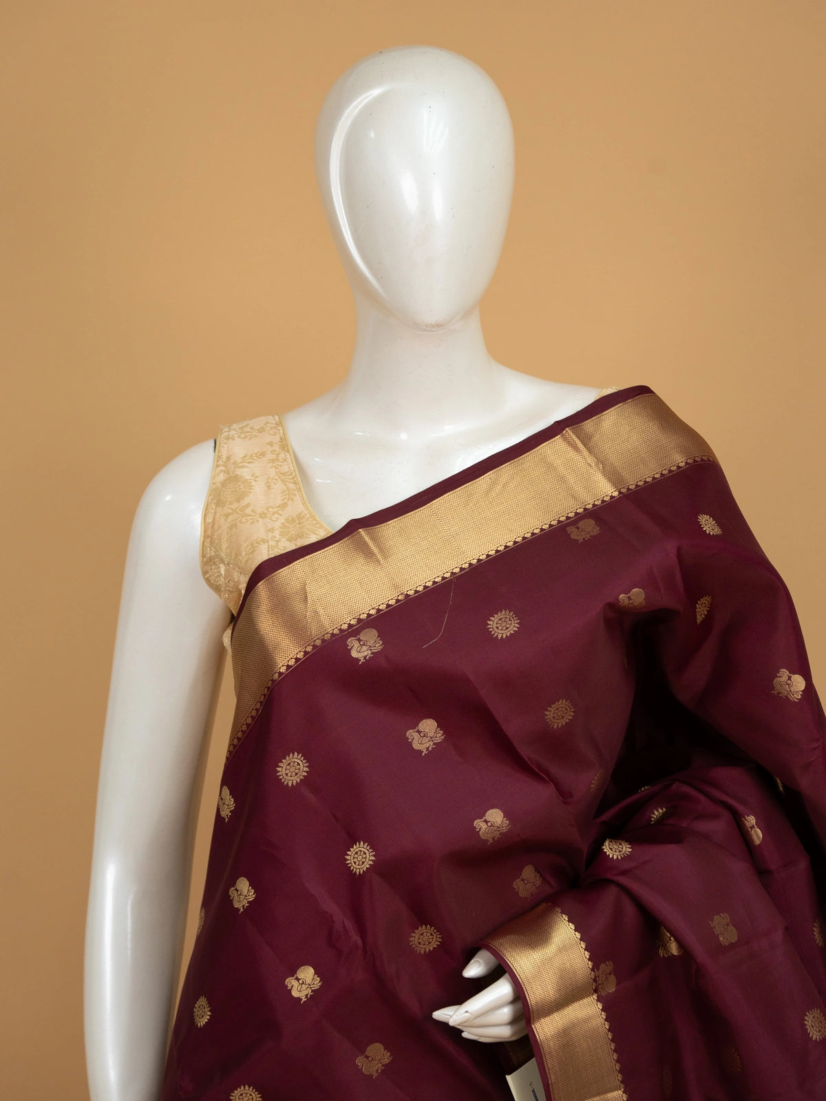 Maroon pure Kanchipuram silk saree with gold zari buttas and contrast zari border