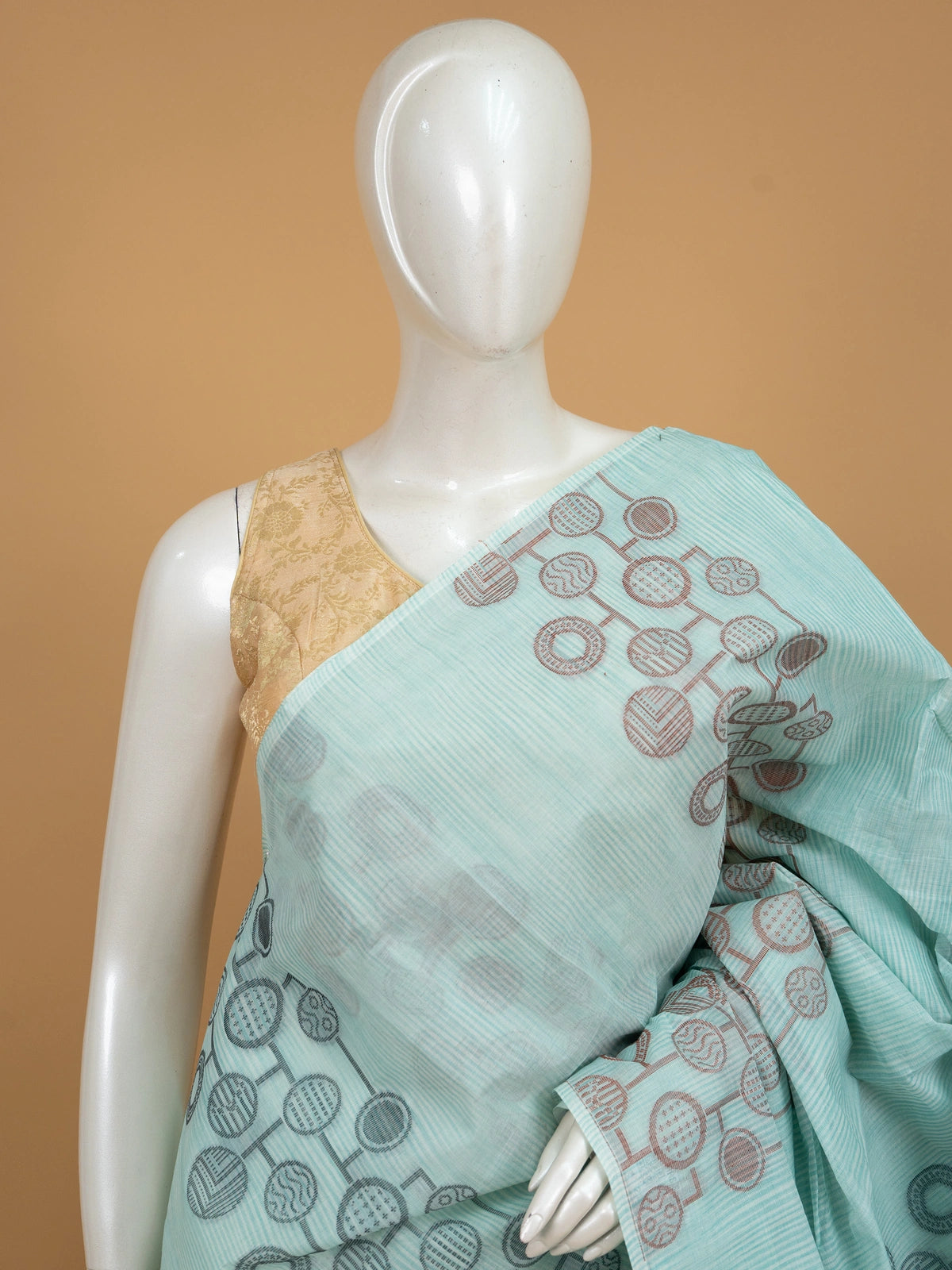 Aqua blue and grey silk cotton saree with circular motifs and copper zari border