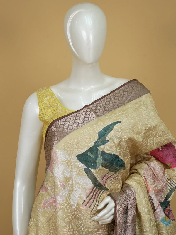 Cream and mauve floral designer tissue saree with woven jaal and contrast zari border