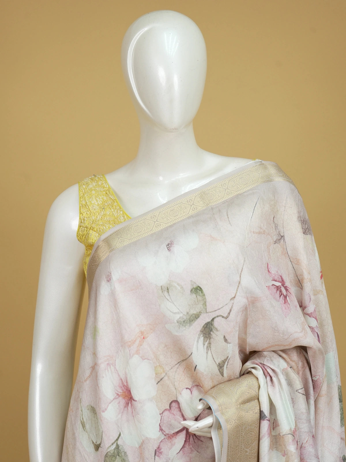 Pastel beige and pink floral designer art silk saree with gold zari border and printed pallu