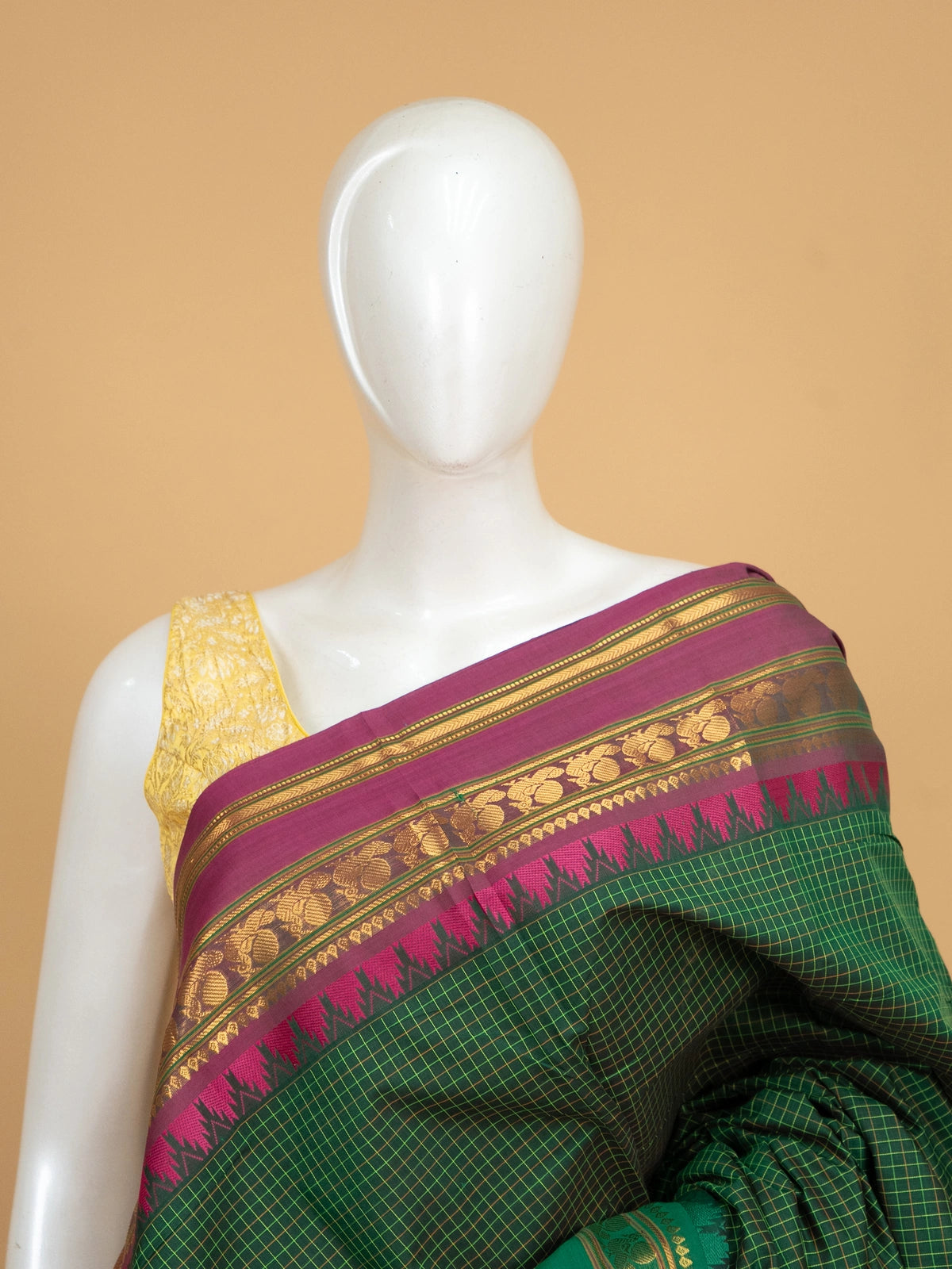 Green Chettinad cotton saree with checked body, contrast magenta gold zari border, and maroon pallu
