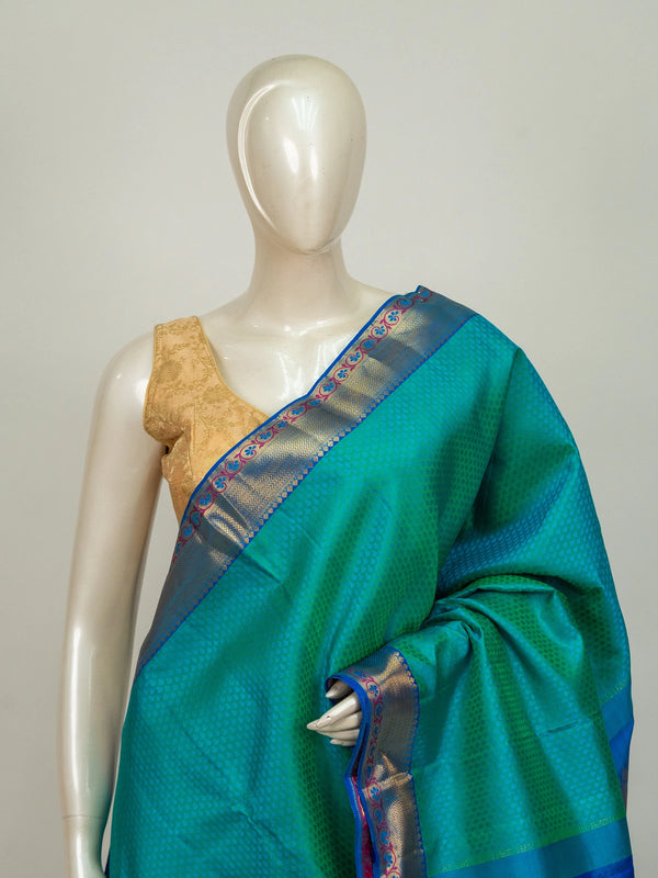 Teal green pure Kanchipuram silk saree with contrast blue and gold zari border and floral zari pallu