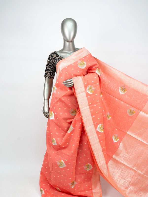 Peach linen cotton saree with silver zari border, peacock motifs and floral zari pallu