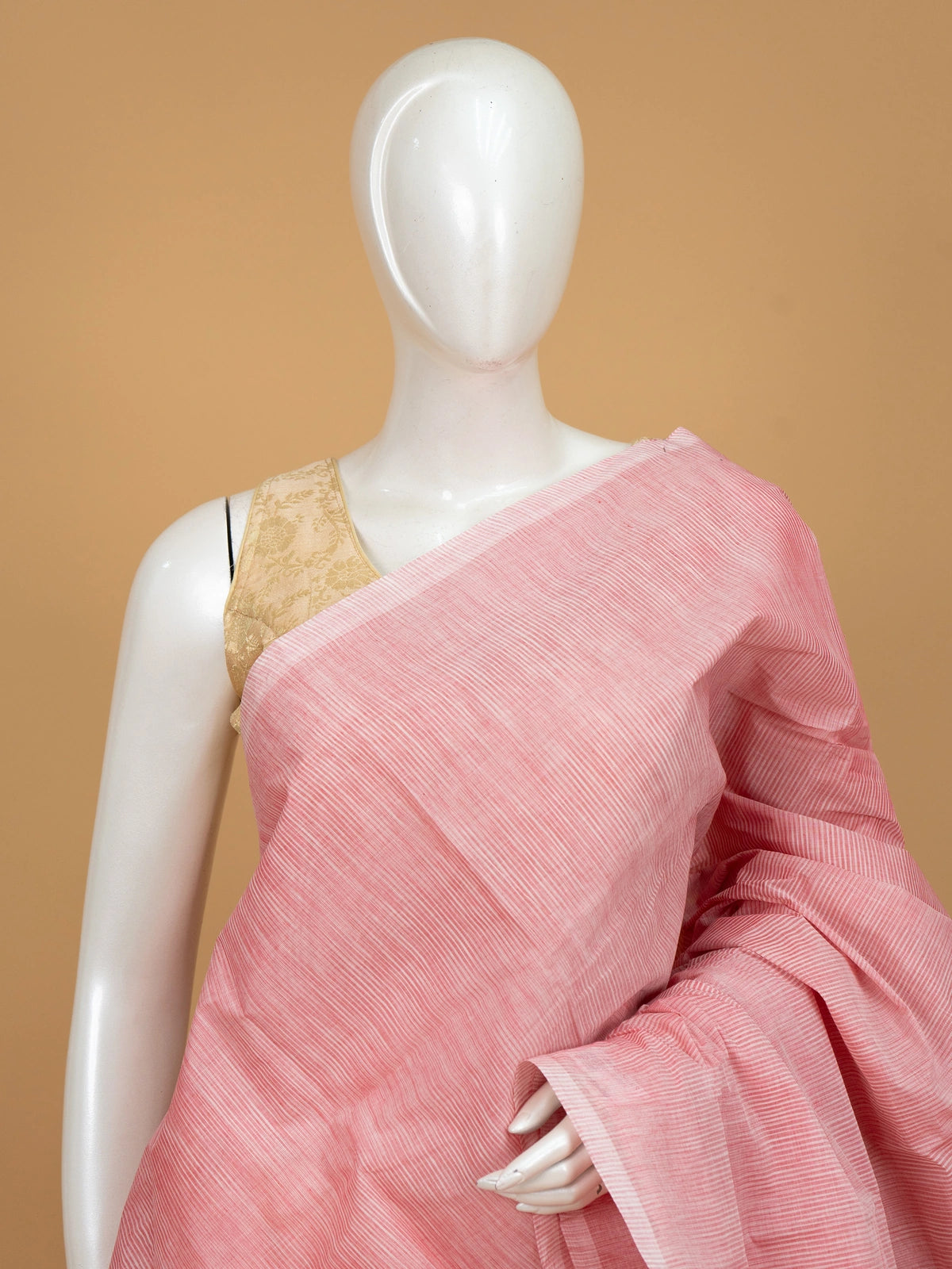 Pink and beige silk cotton saree with fine striped body, contrast beige pallu and golden-lined border