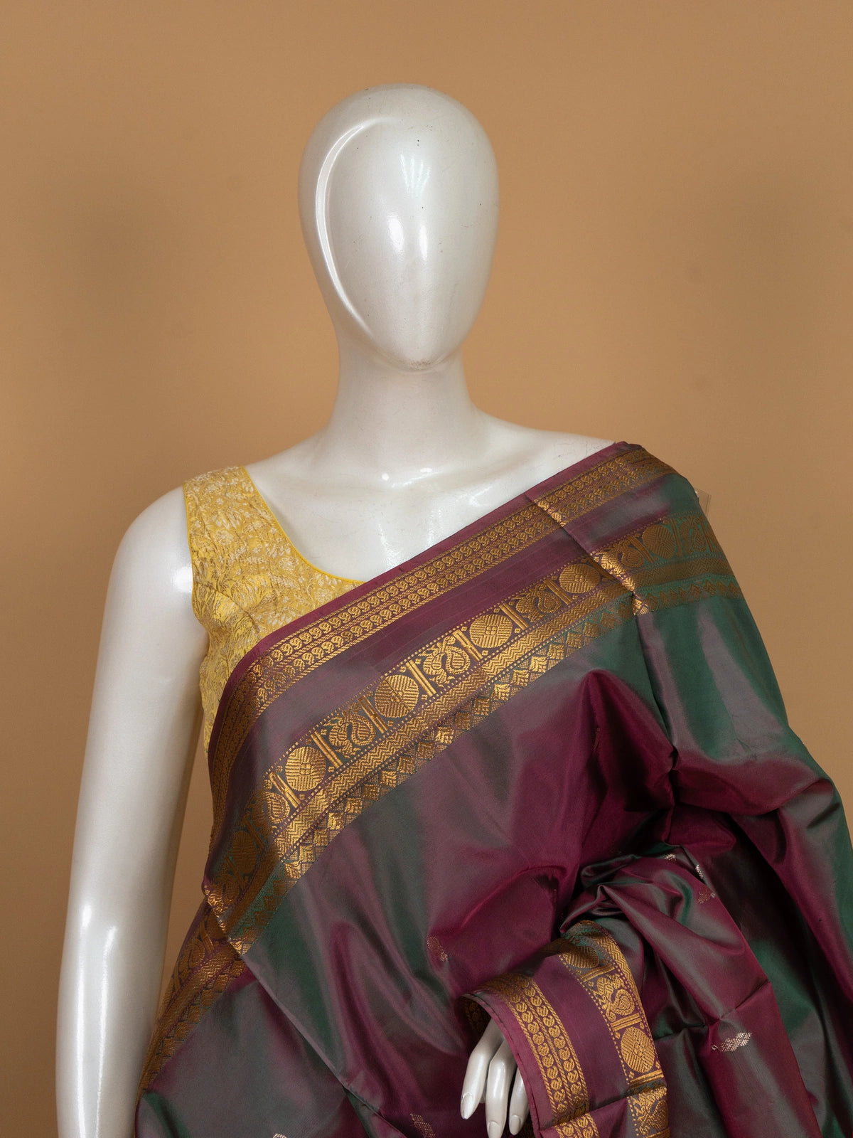 Maroon green banana silk saree with gold zari border and contrast royal blue pallu