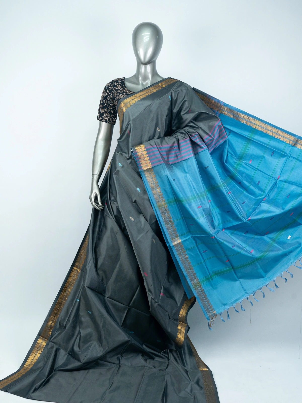 Grey silk saree with contrast blue pallu, gold zari border and black embroidered blouse