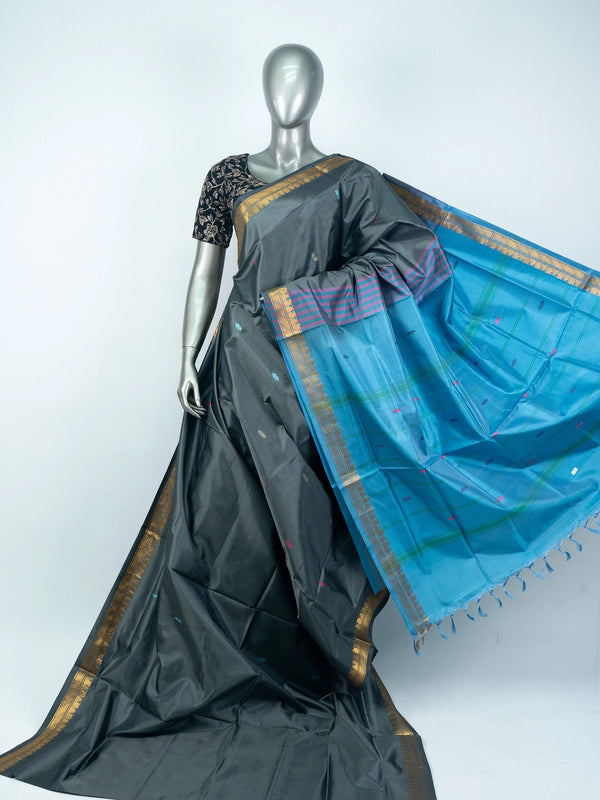 Grey silk saree with contrast blue pallu, gold zari border and black embroidered blouse